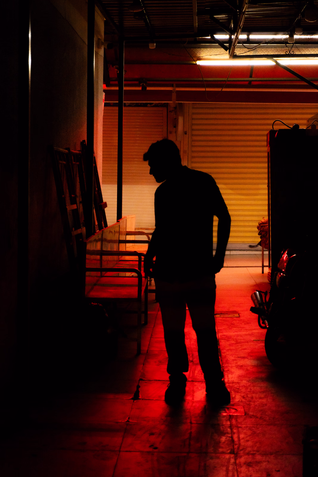 Someone in the dark having cyberpunk-ish background